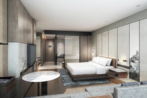 Luxe beddengoed, donsdekens, een minibar, een kluis op de kamer