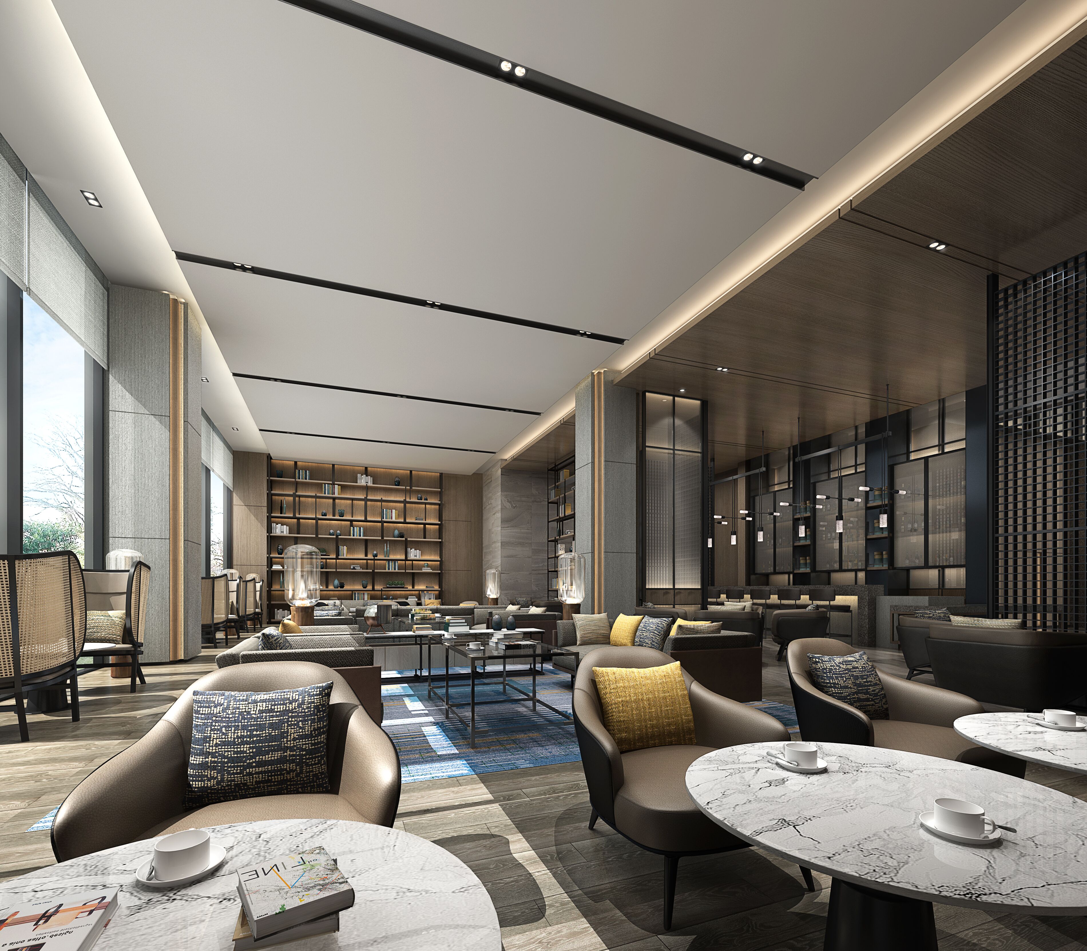 A modern lounge area with leather sofas, marble tables, and a large bookshelf.