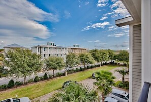 Stroll through the serene surroundings of this two-story house, featuring a spacious balcony and a well-manicured lawn.