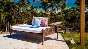 A bed with a view of the ocean, a hanging light fixture, and a pool. - Selectum Hacienda Punta Cana (Punta Cana)