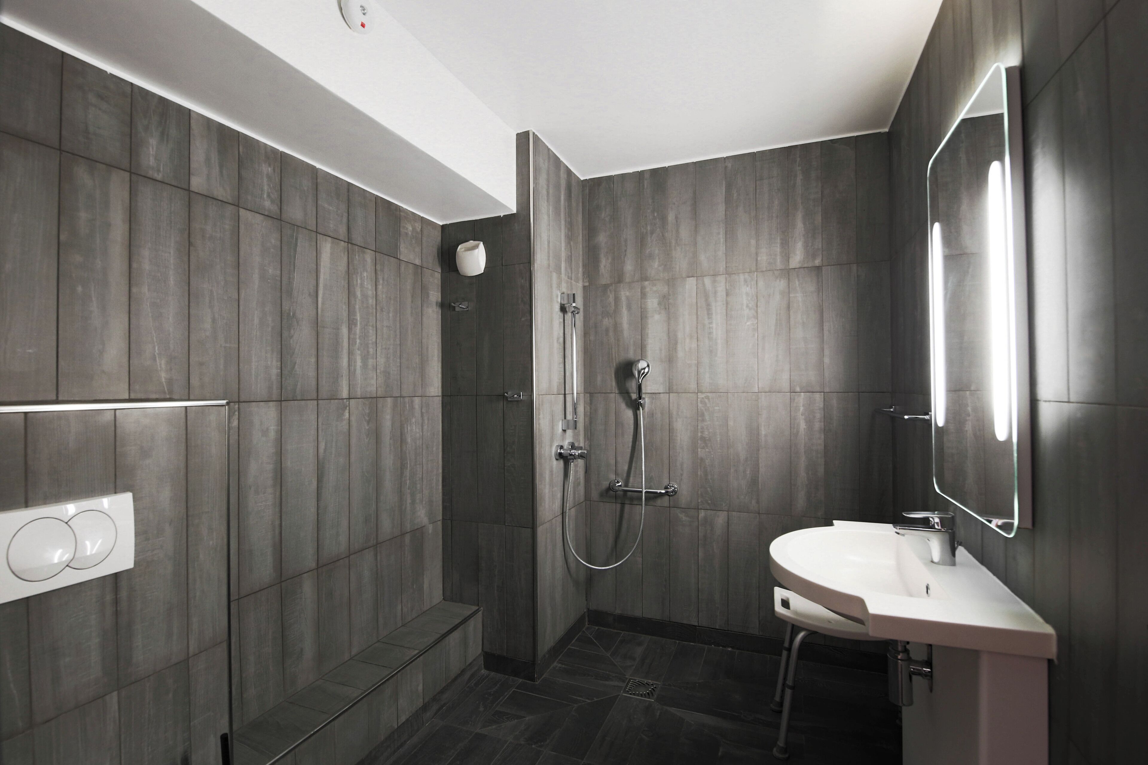 accessible family room with bunkbed and shower | bathroom | towels, toilet paper