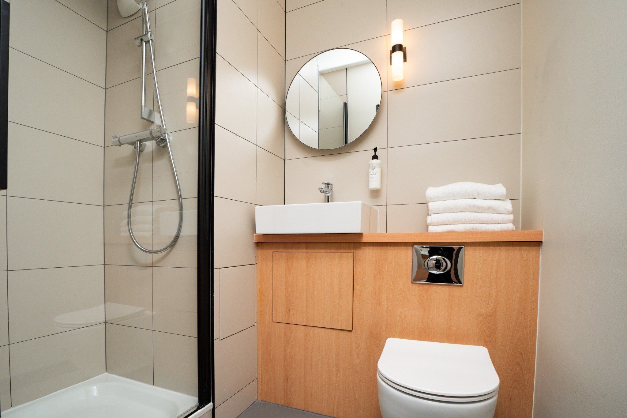 family quadruple room with bunkbeds and shower | bathroom | towels, toilet paper