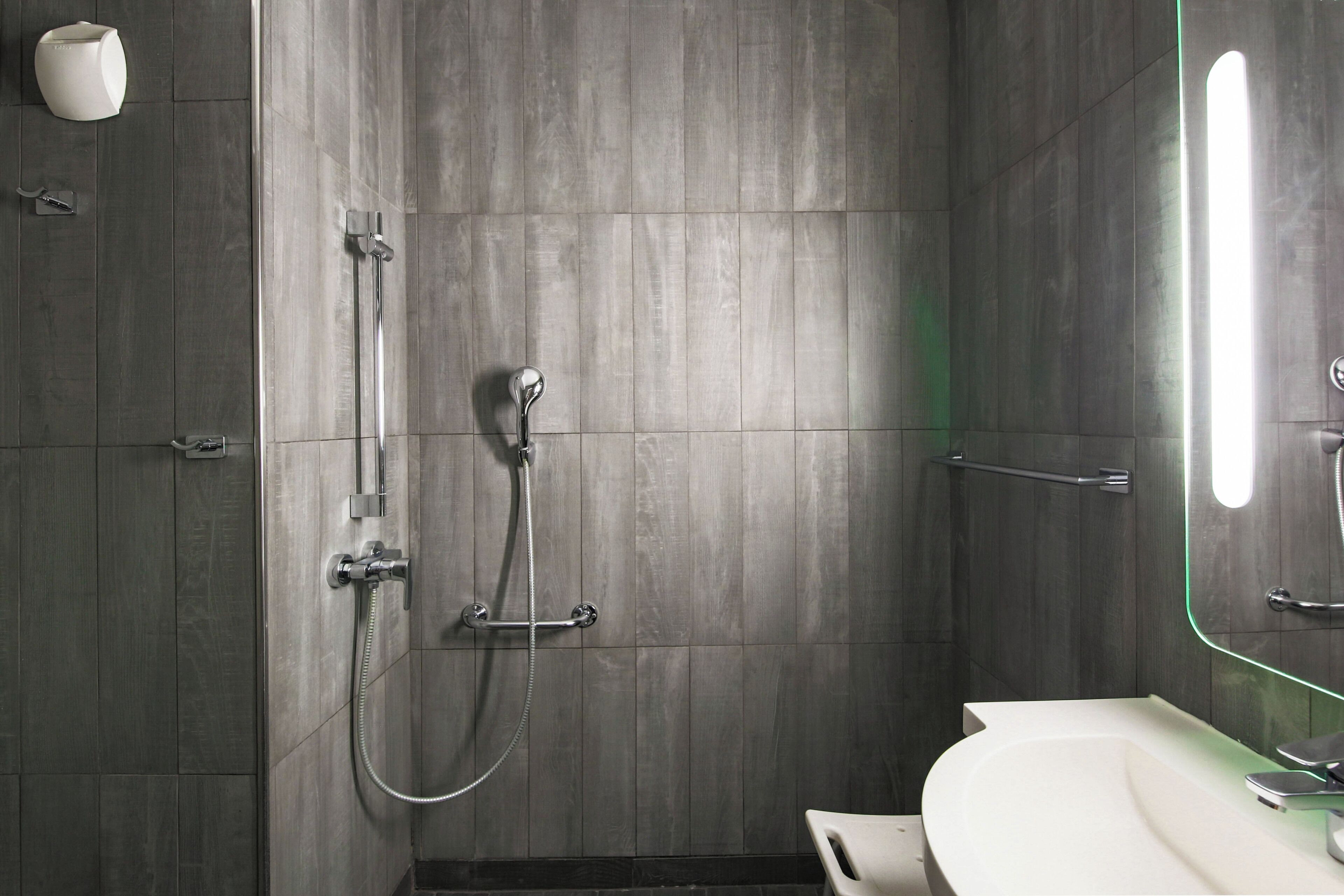 accessible family room with bunkbed and shower | bathroom | towels, toilet paper