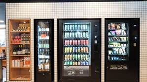 Three beverage vending machines with a variety of drinks and snacks. -  easyHotel Nice Old Town (Nice)