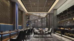 A modern restaurant with a long counter, booths, and a bar area. - Naive S Hotel (Shenzhen)