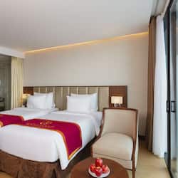 Deluxe Room, Balcony, City View | Minibar, in-room safe, desk, blackout drapes