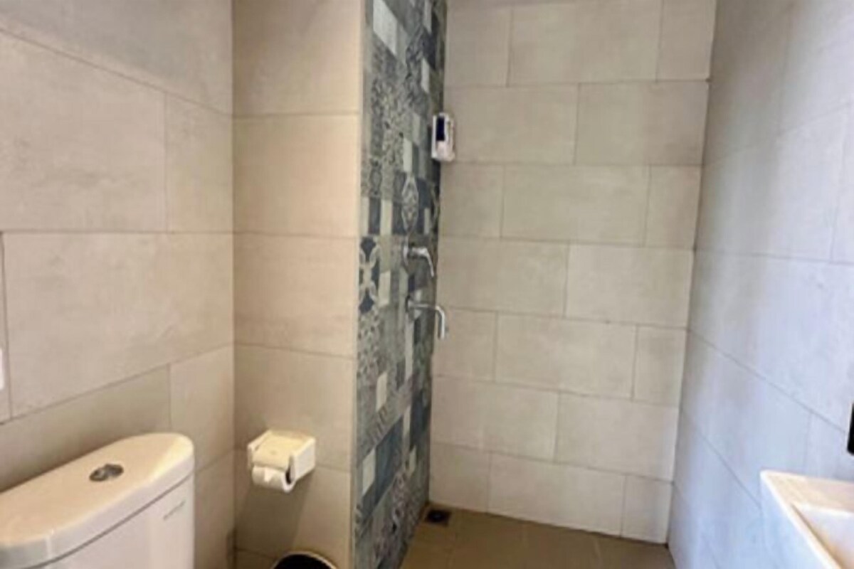 Shower, slippers, towels, soap
