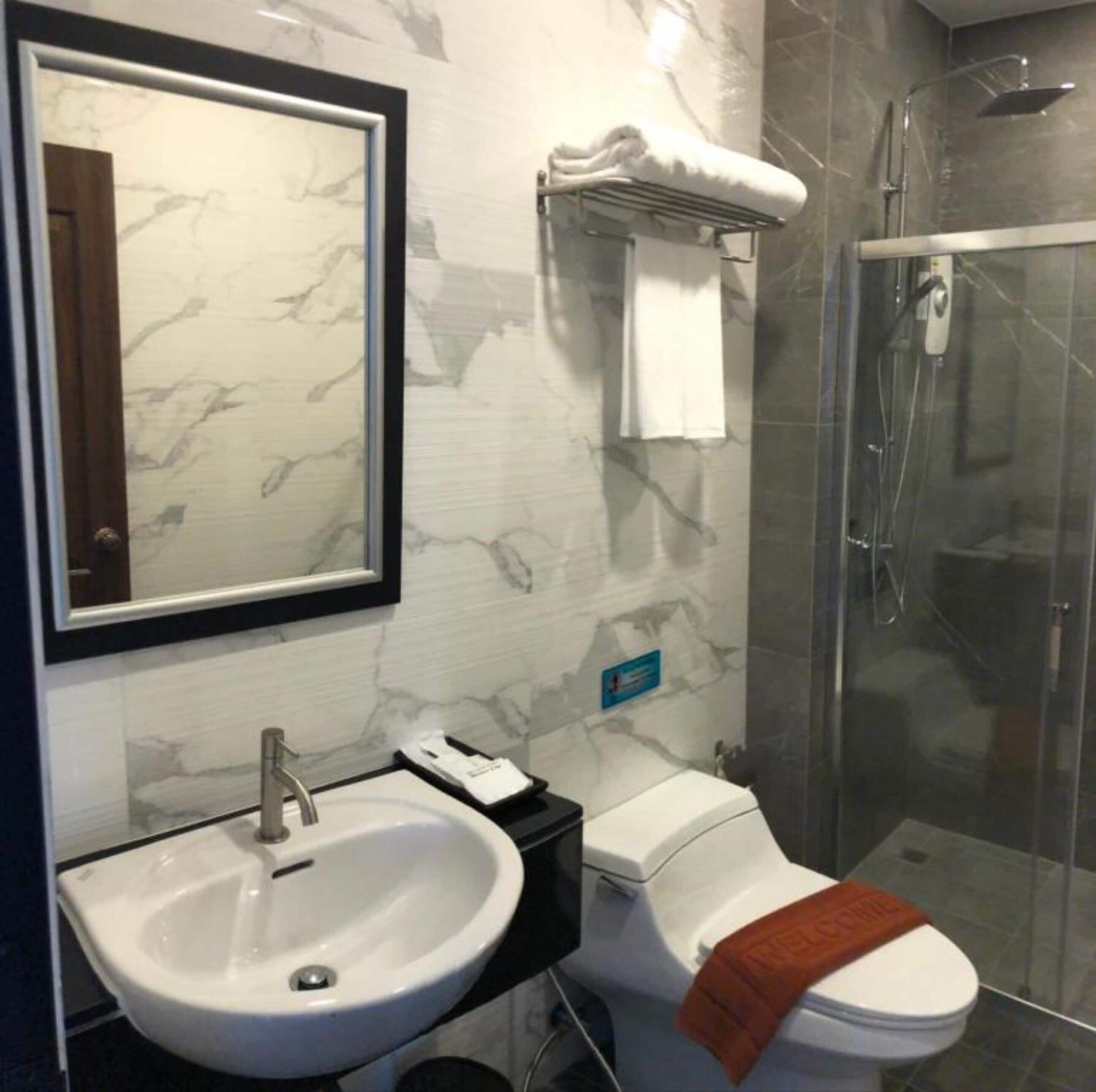 grand deluxe pool view | bathroom | shower, rainfall showerhead, free toiletries, hair dryer