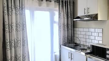 Mini-fridge, microwave, coffee/tea maker, electric kettle