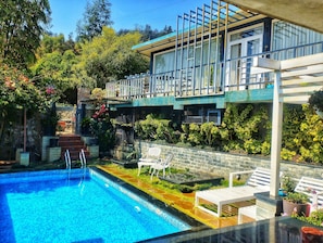 Luxury Suite, Mountain View | Outdoor pool | Outdoor pool, pool loungers