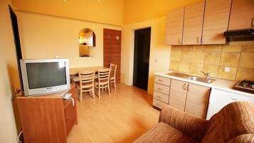 Apartment, 1 Bedroom | Living area | Flat-screen TV