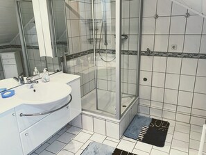 Shower, hair dryer, towels, soap