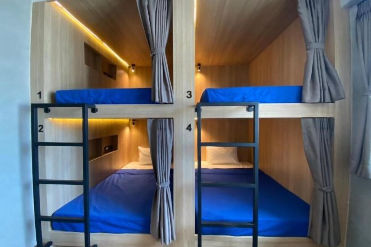 A four-room dormitory with bunk beds, each room numbered from 1 to 4.