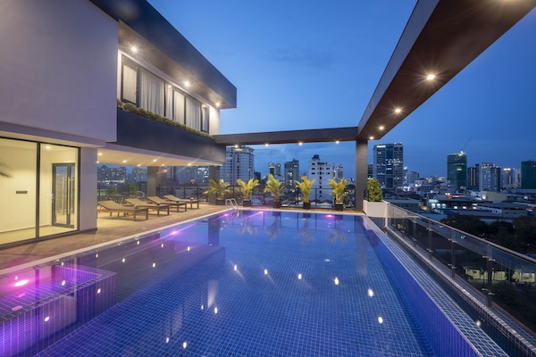 Outdoor pool, open 7:30 AM to 8:00 PM, pool loungers