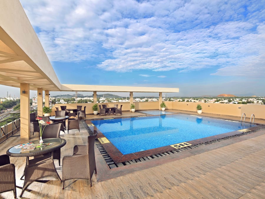 Indoor pool, open 7:00 AM to 7:00 PM, pool umbrellas, pool loungers