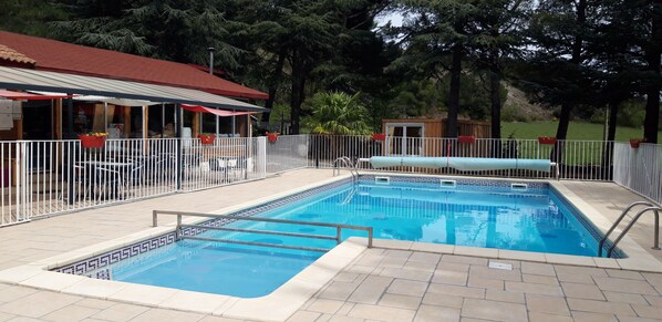 Seasonal outdoor pool, pool umbrellas, pool loungers