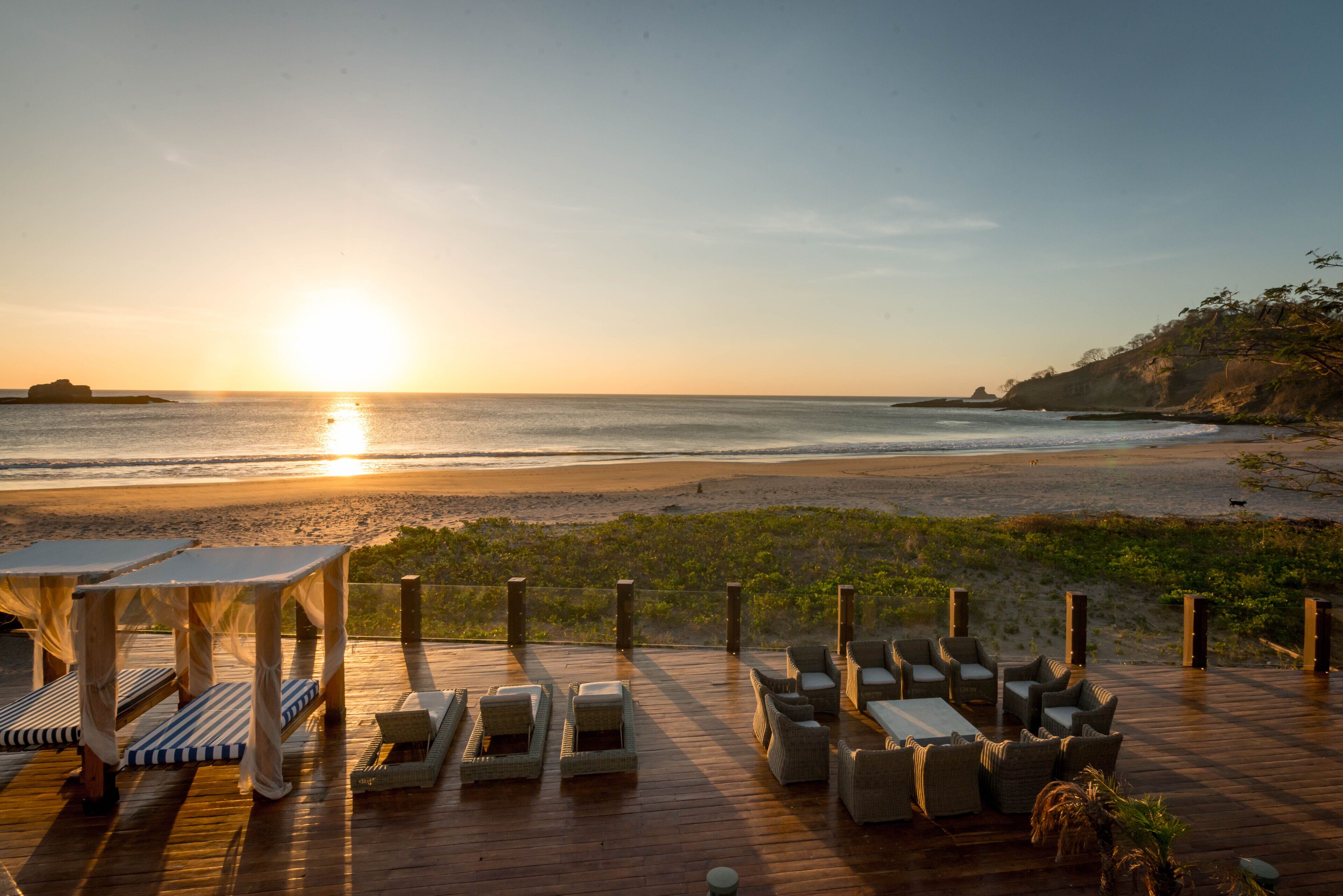 On the beach, sun-loungers