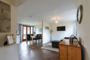 Apartamento familiar | Zona de estar | Televisión de pantalla plana de 40 pulgadas con canales digitales