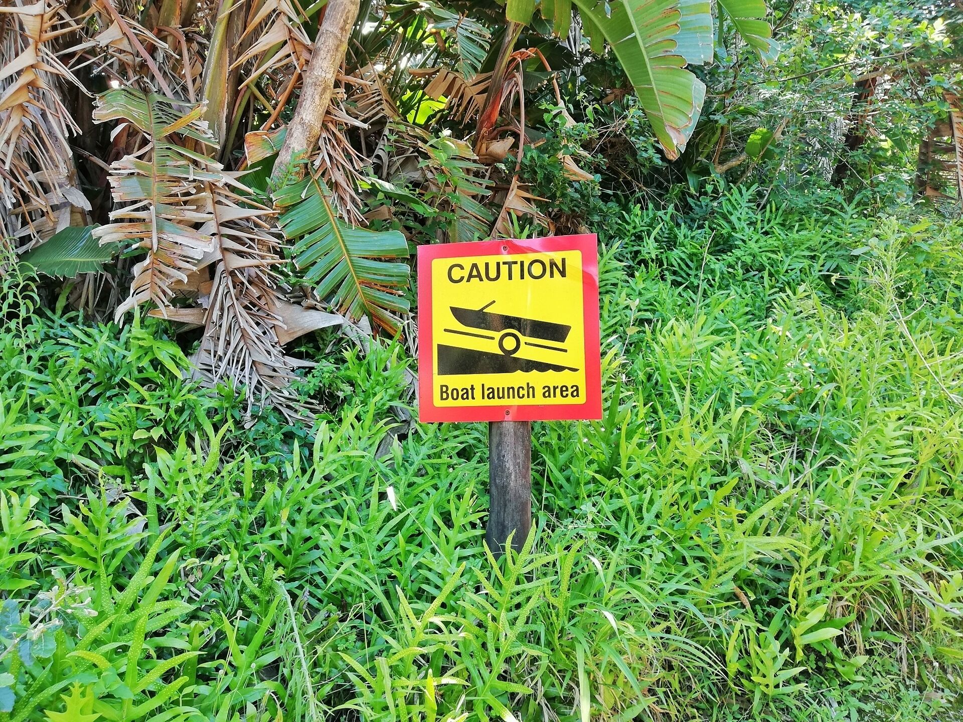 A caution sign indicating a boat launch area.