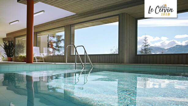 An indoor swimming pool with clear water, a wooden ceiling, and large windows offering a mountain view. - Apartment for rent in les Collons (Thyon-Les Collons)