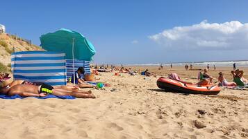 On the beach, sun loungers, beach towels