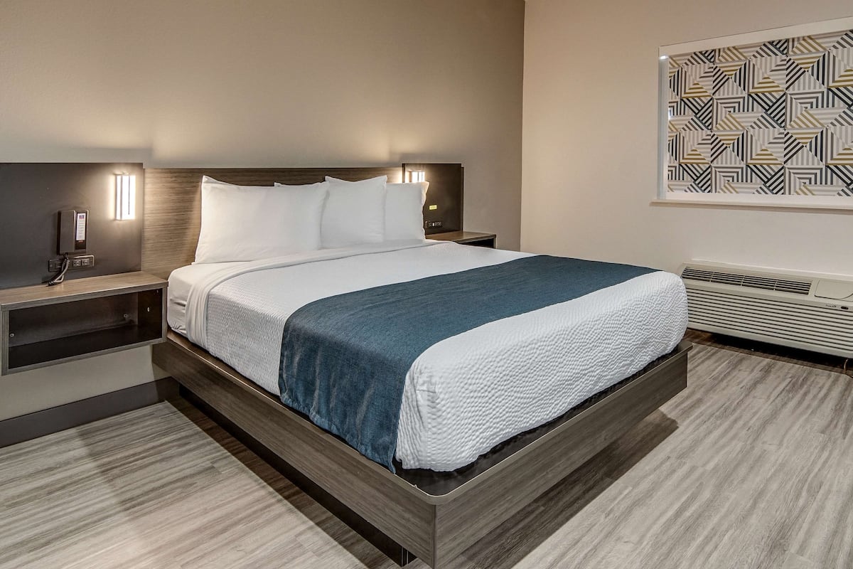 Desk, laptop workspace, blackout curtains, iron/ironing board