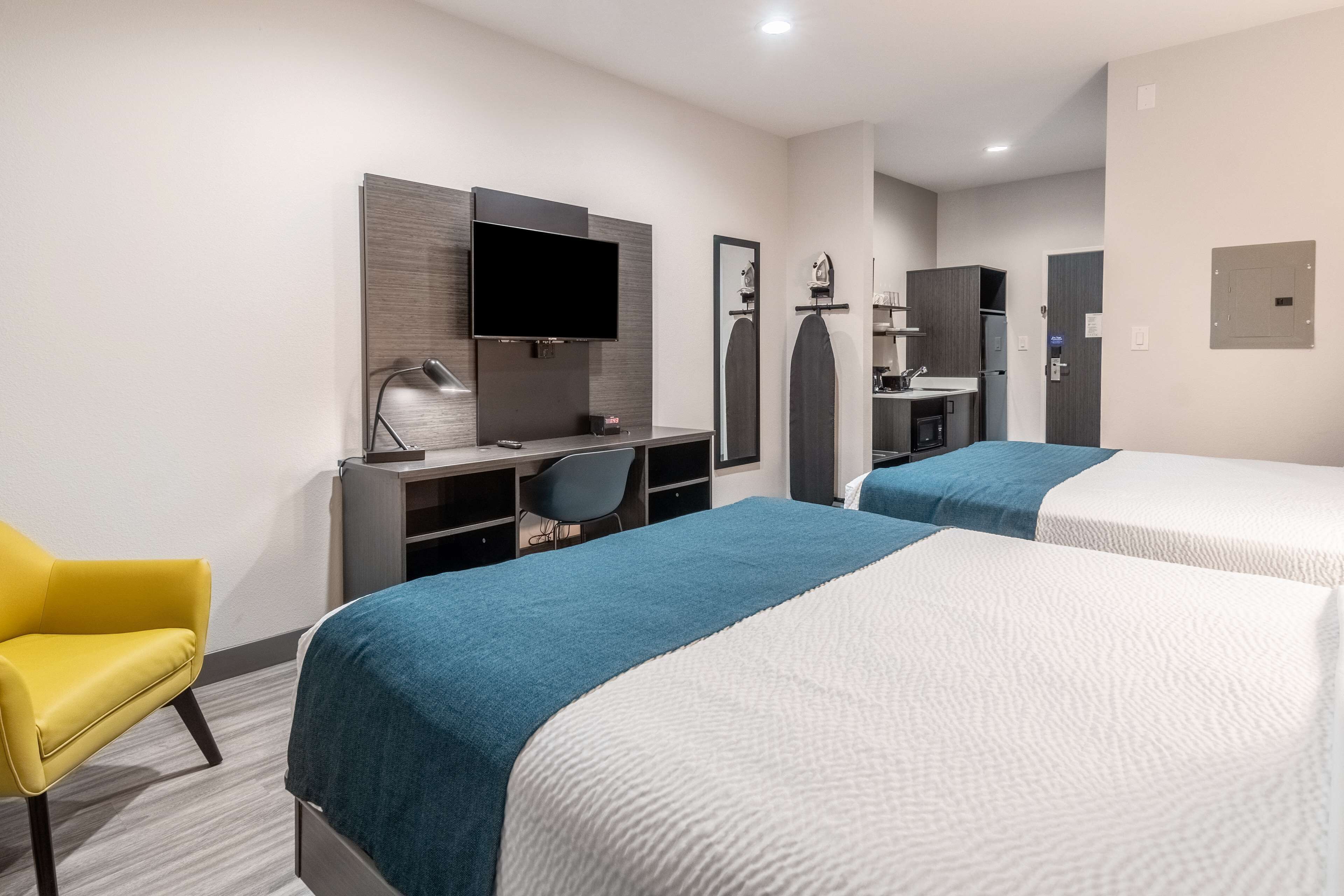 Desk, laptop workspace, blackout curtains, iron/ironing board