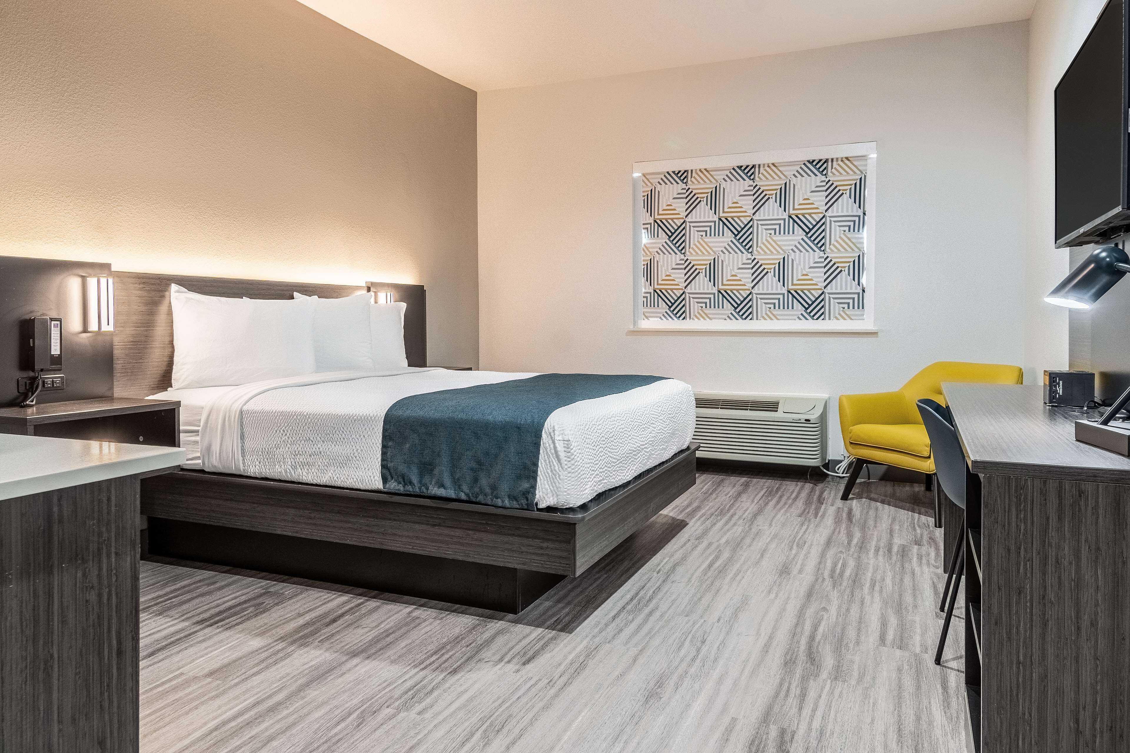 Desk, laptop workspace, blackout curtains, iron/ironing board