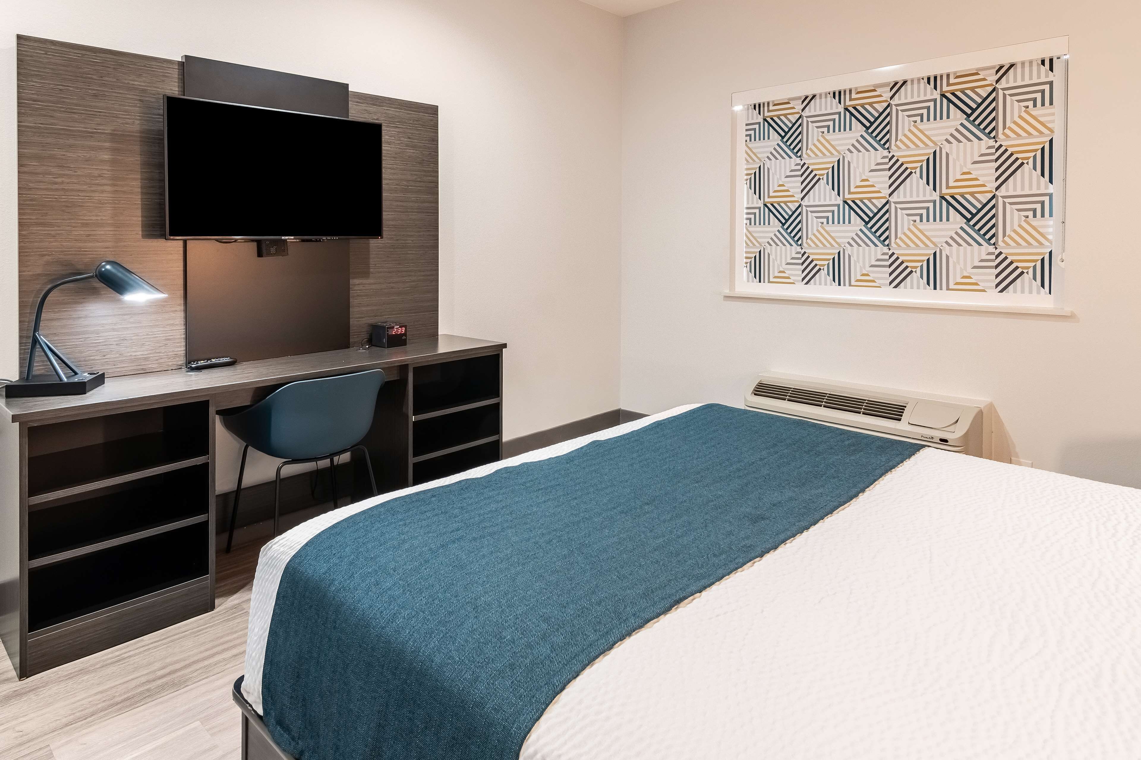 deluxe room, 1 queen bed, non smoking, kitchenette | desk, laptop workspace, blackout curtains, iron/ironing board