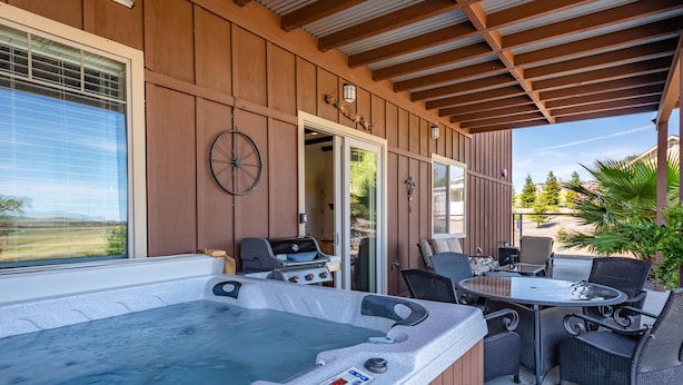A hot tub with controls, a grill, and outdoor seating with chairs and a table. - Luxe 1BR/Studio w/Hot Tub on Templeton's Westside in the Heart of Wine Country! (Templeton)