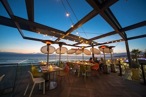 Dine al fresco with a view of the ocean from this outdoor dining area.
