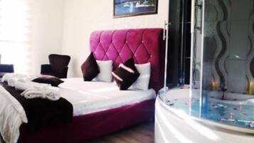 Studio Suite Comfort | Area keluarga | Televisi plasma 180-inci dengan saluran TV satelit dan TV