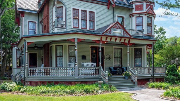A large, multi-story Victorian-style house with a prominent tower and a wrap-around porch. - Gillis Grier Bed & Breakfast (Salisbury)