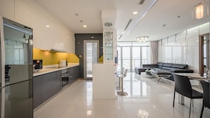 Superior Apartment, 4 Bedrooms | Living area | 55-inch Smart TV with digital channels, TV - Vinhomes Luxury - Kelvin's Home (Ho Chi Minh City)