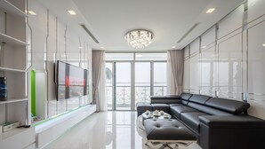 Superior Apartment, 4 Bedrooms | Living area | 55-inch Smart TV with digital channels, TV - Vinhomes Luxury - Kelvin's Home (Ho Chi Minh City)