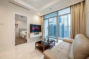 Luxury Apartment, 3 Bedrooms | Living area | 55-inch Smart TV with digital channels, TV - Vinhomes Luxury - Kelvin's Home (Ho Chi Minh City)