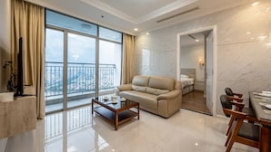 Luxury Apartment, 3 Bedrooms | Living area | 55-inch Smart TV with digital channels, TV - Vinhomes Luxury - Kelvin's Home (Ho Chi Minh City)