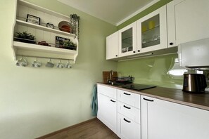 Fridge, microwave, stovetop, coffee/tea maker