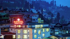 A hotel named SUMITEL Suites & Spa with multiple floors and a prominent sign. - Sumitel Hotel 500 meters from Mall Road (Darjeeling)