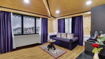 Premium Quadruple Room, Mountain View | Living area | 42-inch LED TV with satellite channels, TV