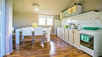Fridge, oven, stovetop, dining tables