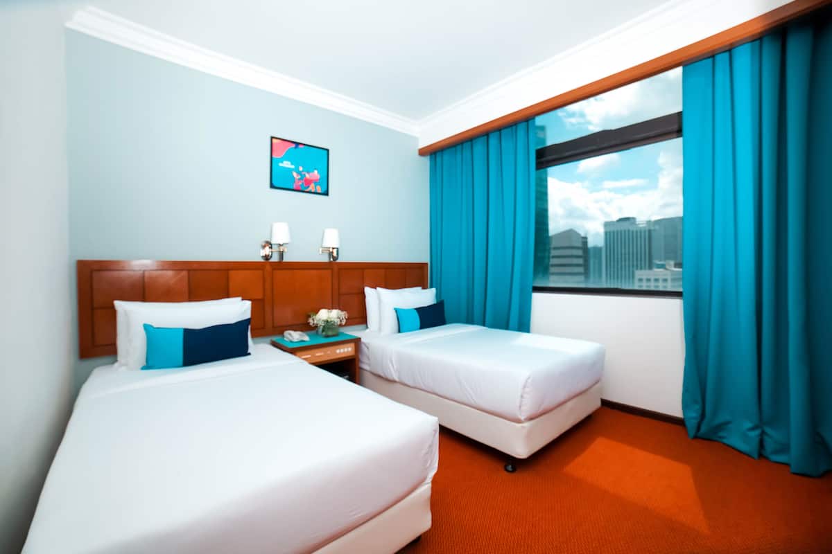 Superior Twin Room | Minibar, in-room safe, desk, laptop workspace