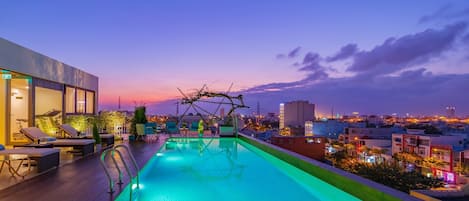 Outdoor pool, open 6:30 AM to 8:30 PM, pool umbrellas, pool loungers