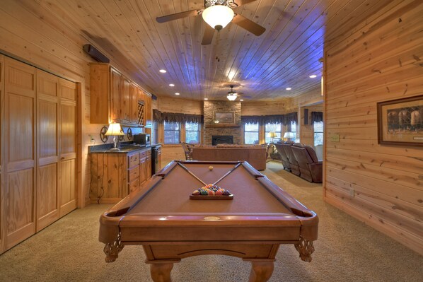 A pool table in a wooden room with a ceiling fan and recessed lighting. - Fraggle Rock - Blue Ridge (Mineral Bluff)