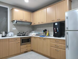 Fridge, oven, electric kettle, cookware/dishes/utensils