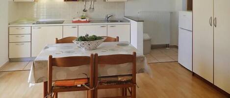 Fridge, stovetop, dining tables