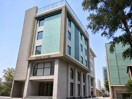 A modern building with a sign reading 'COSTA RIVER.'
