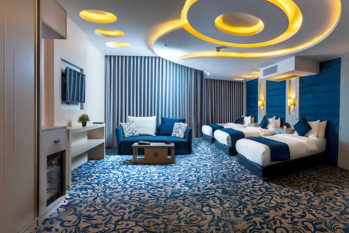 family room | 1 bedroom, minibar, in-room safe, blackout curtains