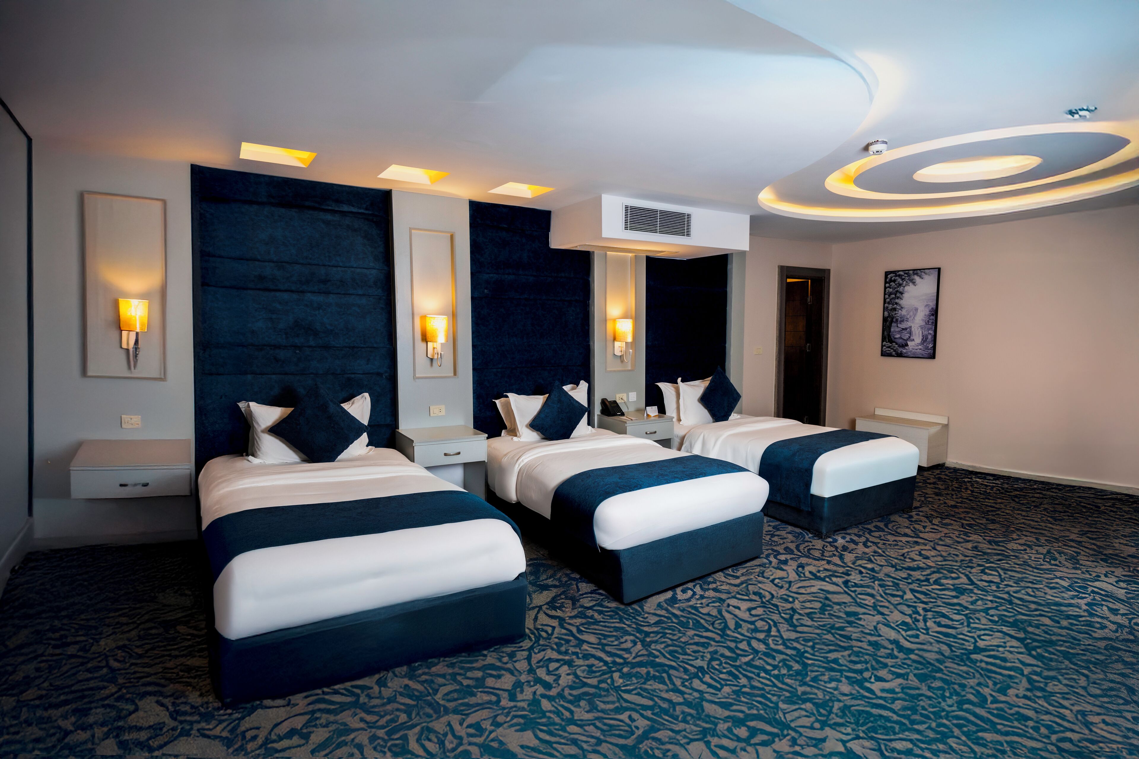 family room | 1 bedroom, minibar, in-room safe, blackout curtains