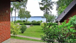A brick building with a view of a lake.